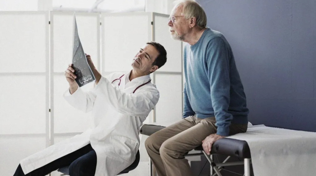 Doctor examining patient for Parkinson's symptoms